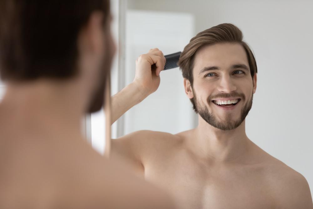 A man satisfied with his hair transplant result