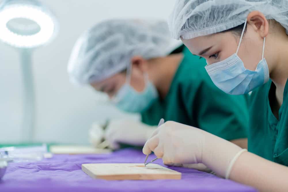 Surgeons conducting a hair transplant procedure