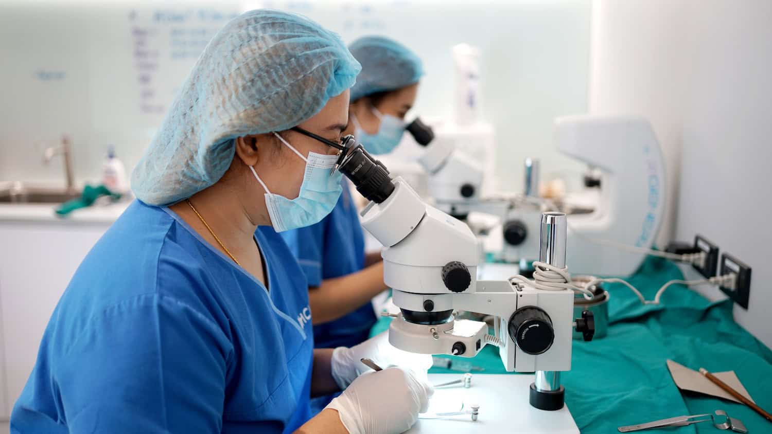 Surgeons at work on DHI micrograft hair transplant