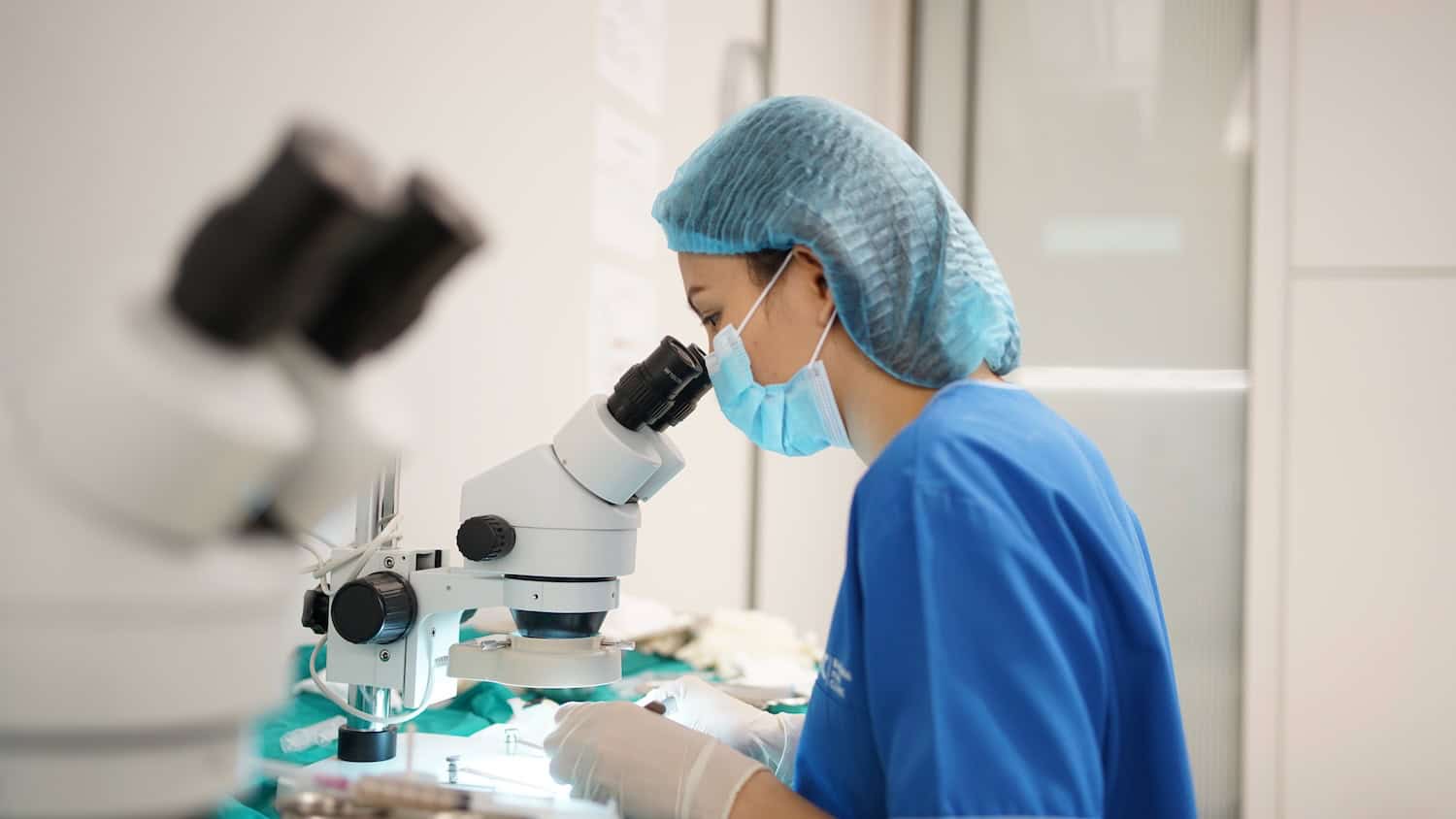 Technician performing DHI hair transplant in Bangkok