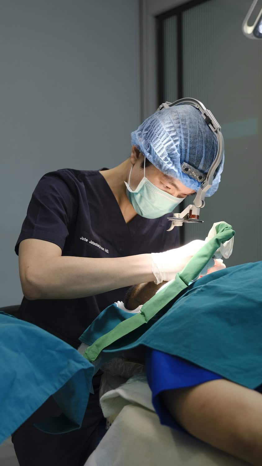 Surgeon performing DHI hair transplant in Bangkok